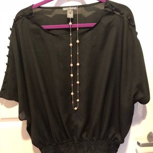 Dressy black top - cute details.